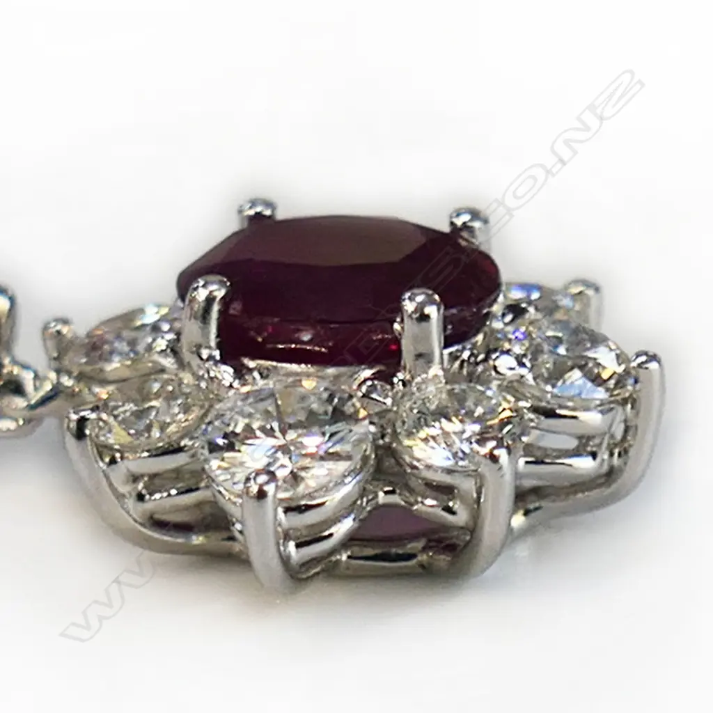 An 18ct white gold ruby and diamond pendant, Image 1++