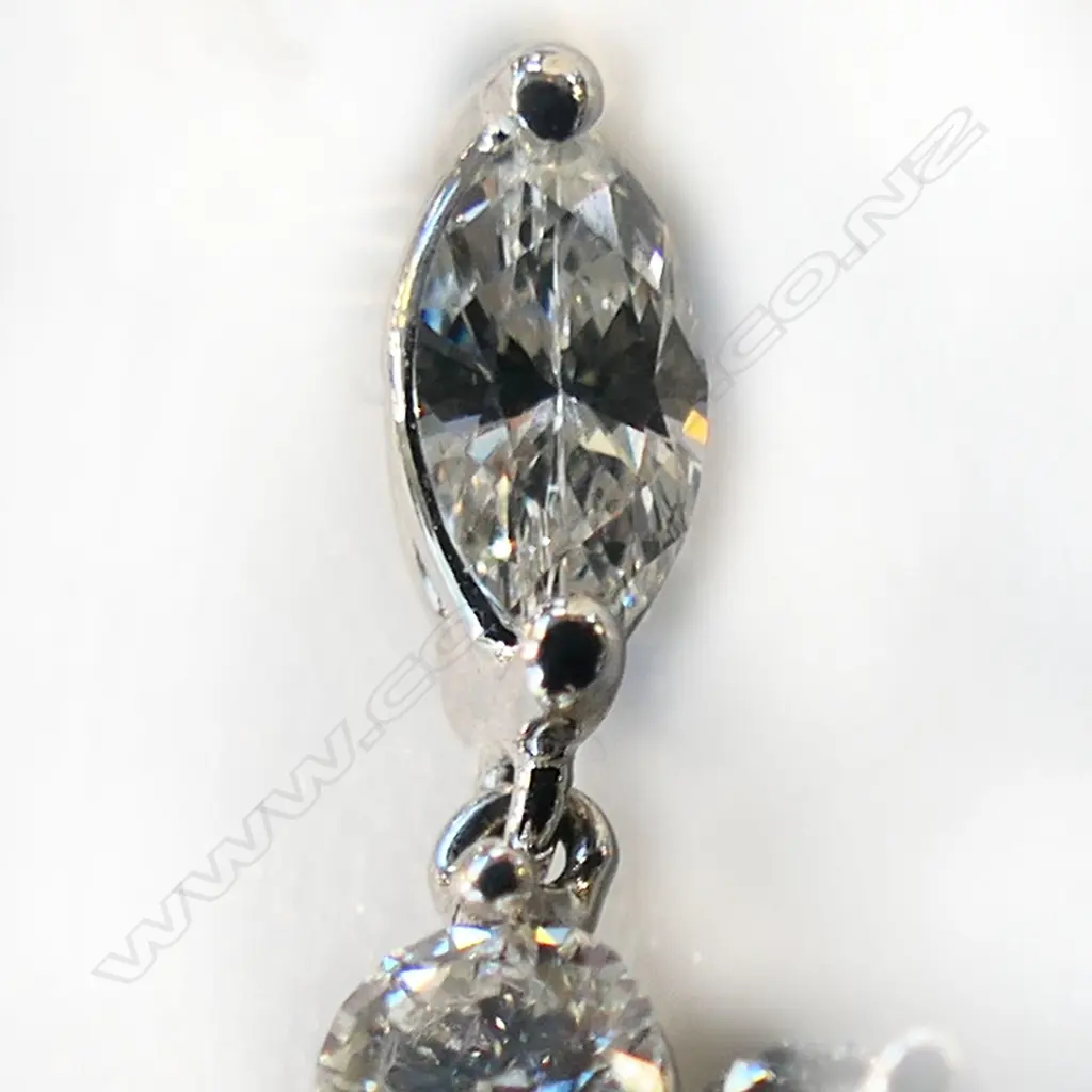 An 18ct white gold ruby and diamond pendant, Image 1++