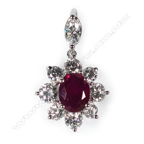 An 18ct white gold ruby and diamond pendant,