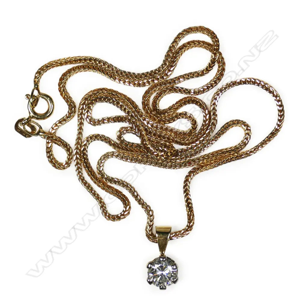 An 18ct gold and diamond pendant on chain, Image 1++