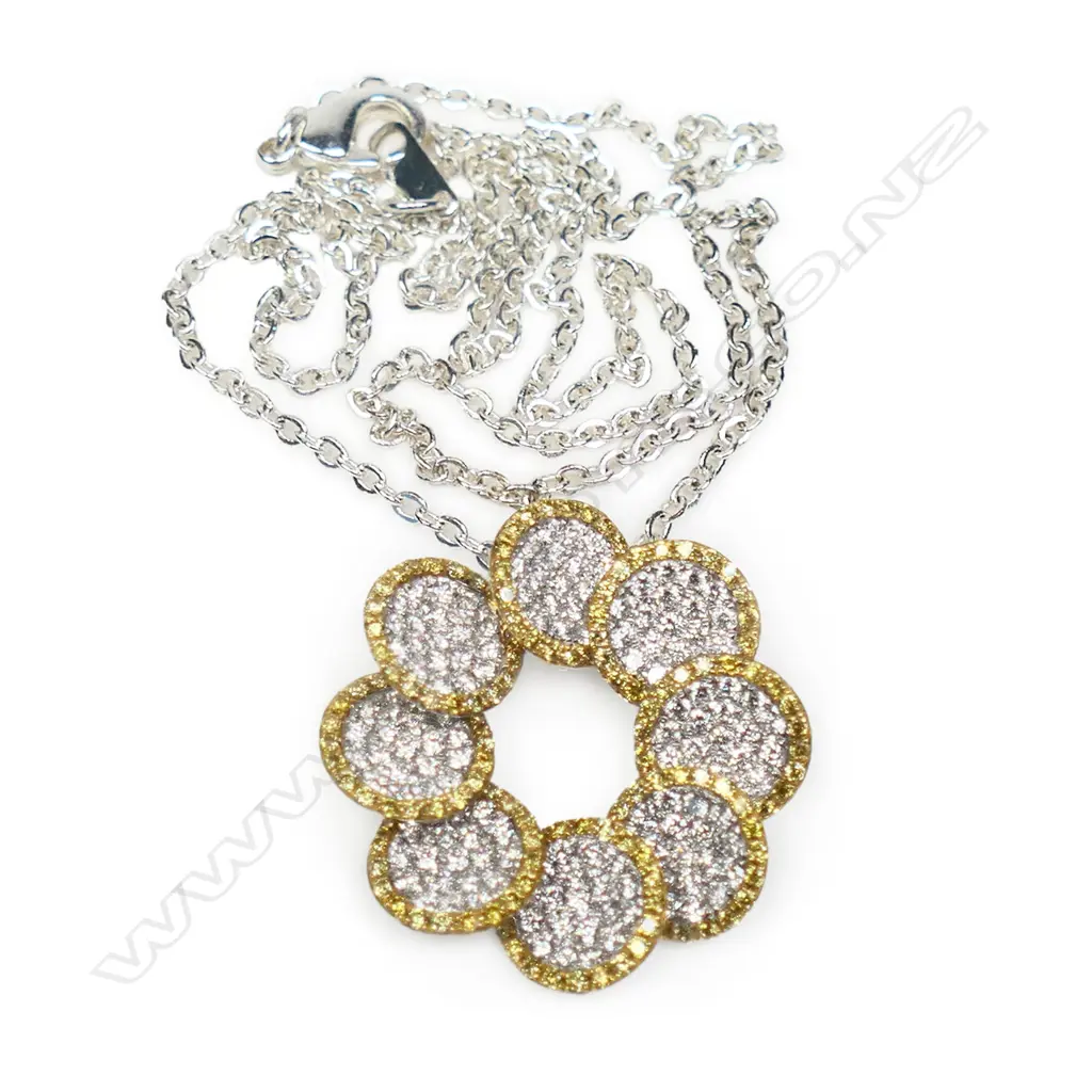 An 18ct white gold and multi diamond pendant, Image 1++