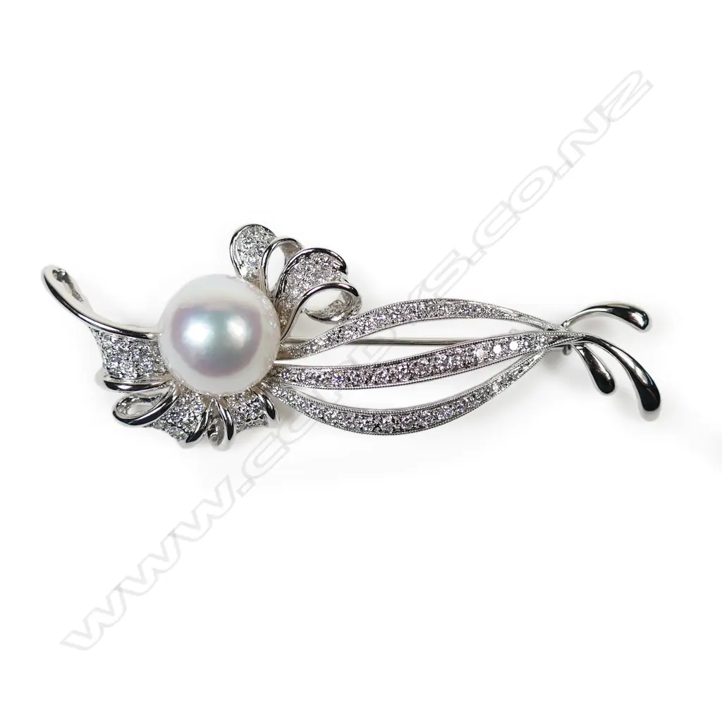 An 18ct white gold diamond and pearl brooch, Image 1++