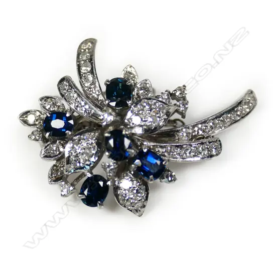 A stylish vintage 14ct white gold sapphire and diamond spray brooch,