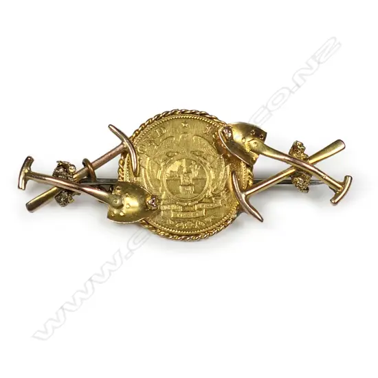 A late 19thC gold coin and mining themed brooch,