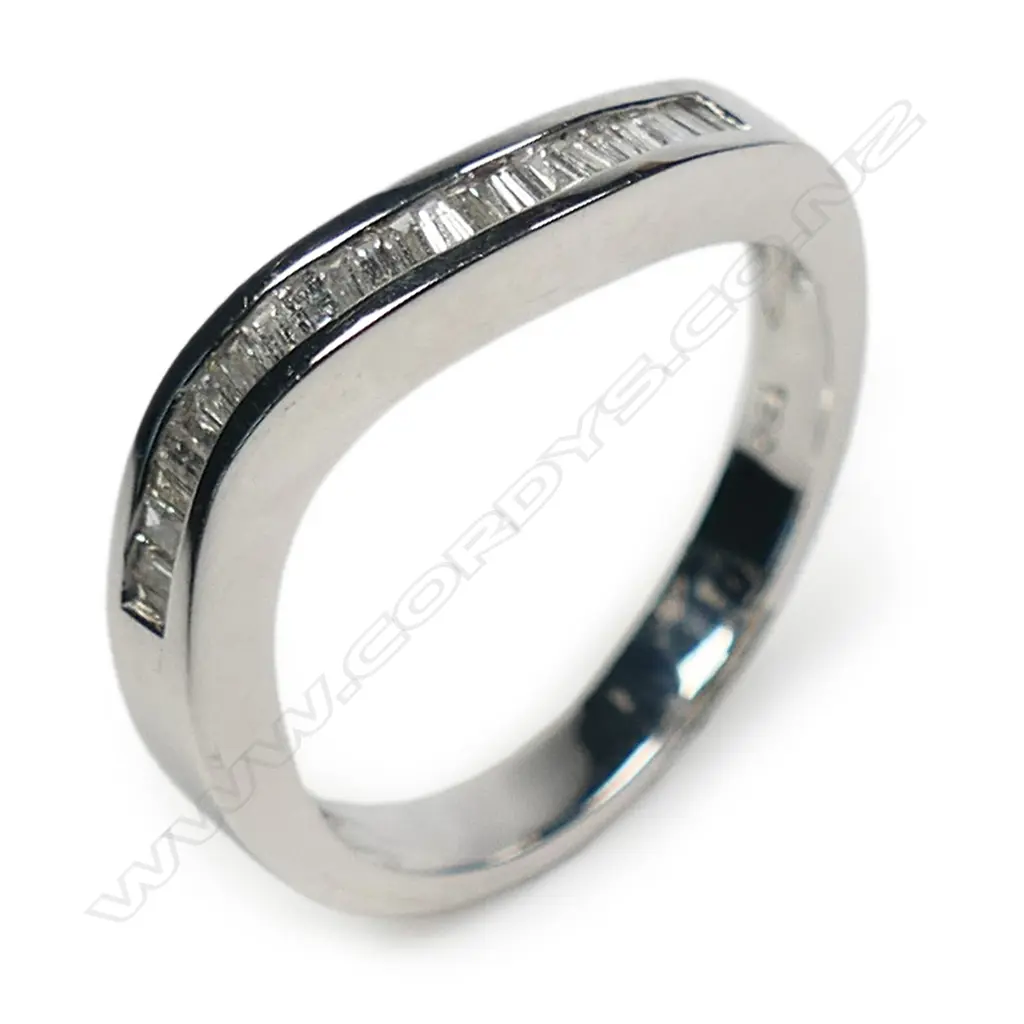 An 18ct white gold and diamond undulating band ring, Image 1++