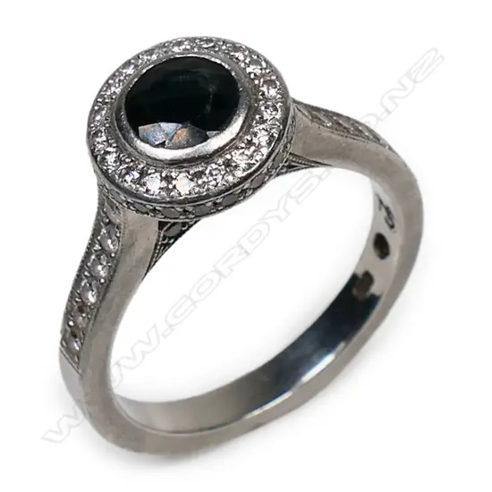 A Naveya & Sloane platinum sapphire and diamond ring,
