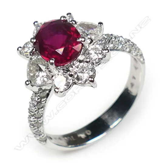 An 18ct white gold diamond and ruby ring,