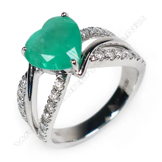 A 14ct white gold Columbian emerald and diamond ring,