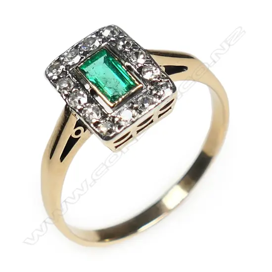 An estate 18ct gold emerald and diamond ring,