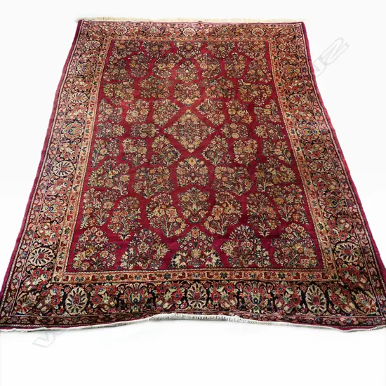 A large vintage hand-knotted Persian carpet,