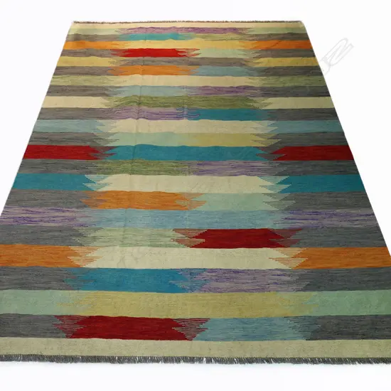 A hand-woven kilim carpet,