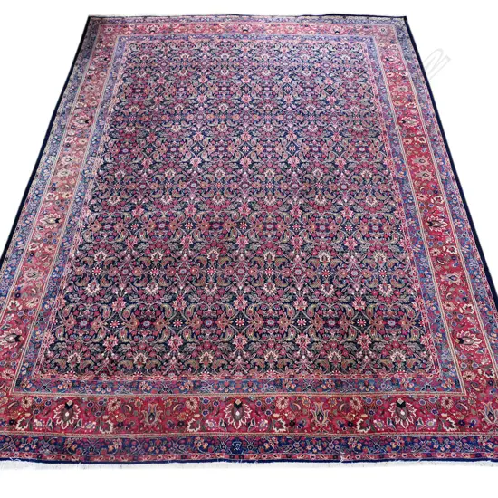 A large hand knotted Persian carpet,