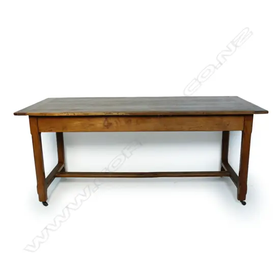 A vintage French fruitwood refectory dining table,