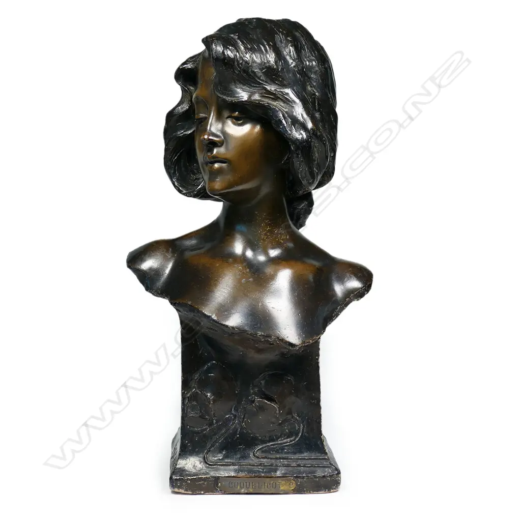 A French Art Nouveau pottery bust of a young woman, Image 1++