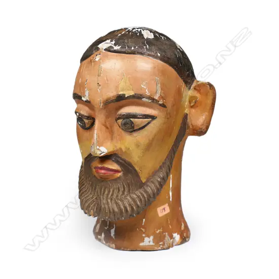 A vintage folk art painted wood and gesso head,