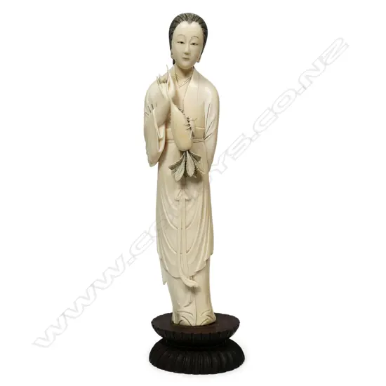 An antique Japanese carved ivory figure,