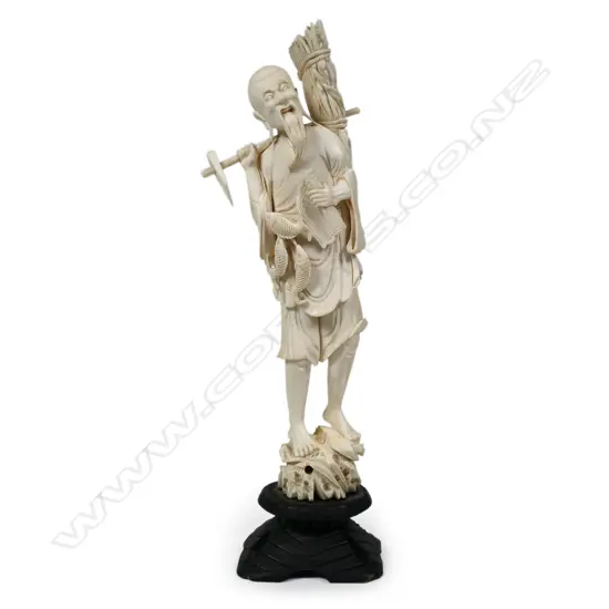 An antique Japanese carved ivory figure,