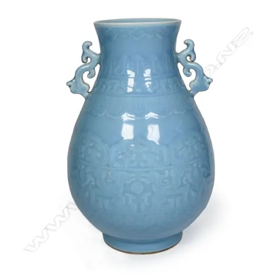 A Chinese porcelain blue celadon double dragon vase,
