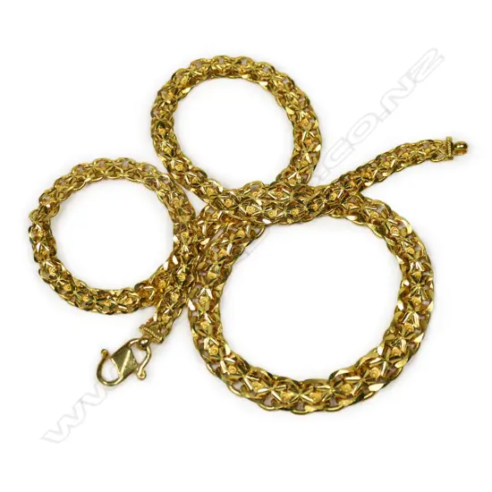 A 24ct gold graduated fancy link chain,