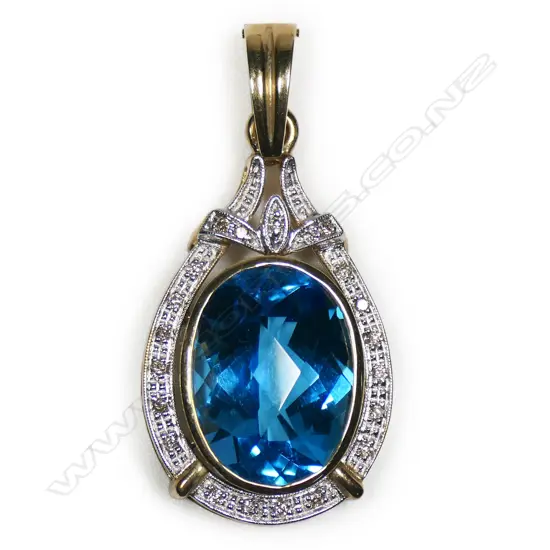 A 9ct gold blue topaz and diamond enhancer,