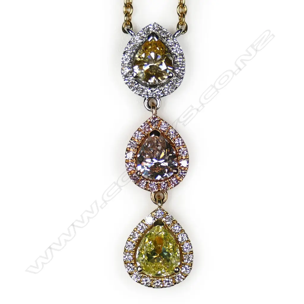 An 18ct white rose and yellow gold graduated pear shaped diamond drop necklace, Image 1++