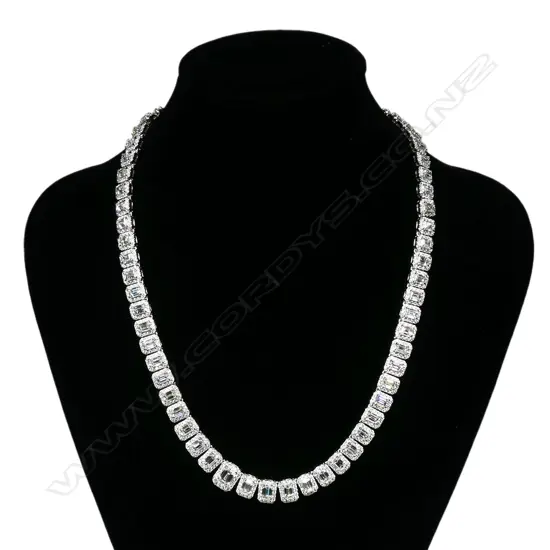 An impressive 18ct white gold and multi emerald cut diamond articulated necklace,