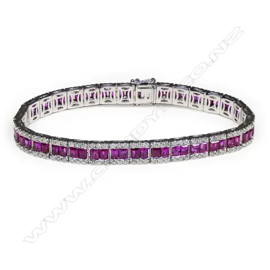 An 18ct white gold diamond and pink sapphire articulated bracelet,