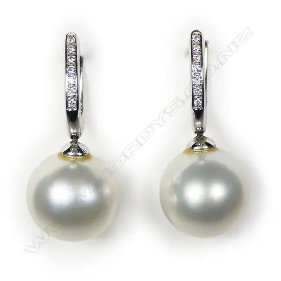 A pair of 18ct white gold diamond and pearl earrings,