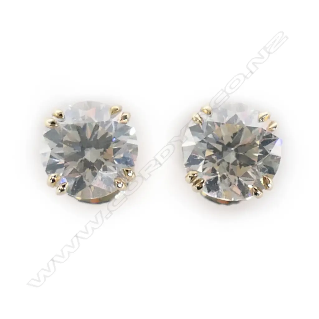 A pair of 14ct gold and diamond stud earrings, Image 1++