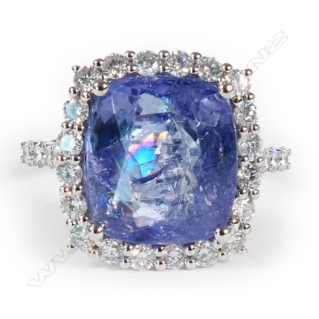 A 14ct white gold tanzanite and diamond halo ring, Image 1++