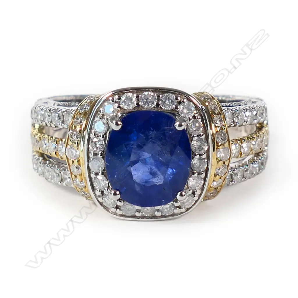 A 14ct yellow and white gold Ceylonese sapphire and diamond halo ring, Image 1++