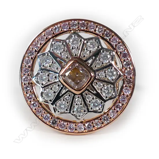 A 14ct white and rose gold pink diamond halo dress ring,