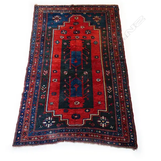 A hand-woven Kazak rug,