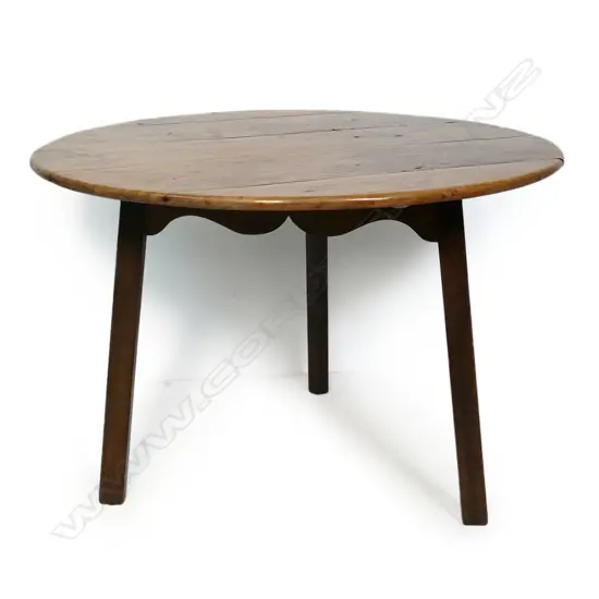 An antique pine cricket table,