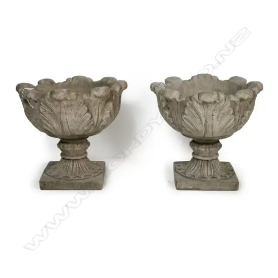 A pair of classical acanthus leaf pedestal urns,