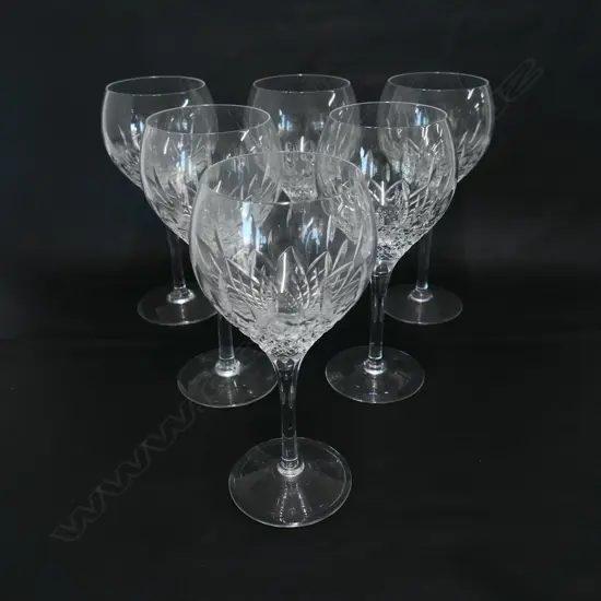 A impressive set of six Stuart crystal long stemmed wine glasses,
