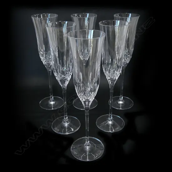 A set of six Waterford crystal tall champagne glasses,