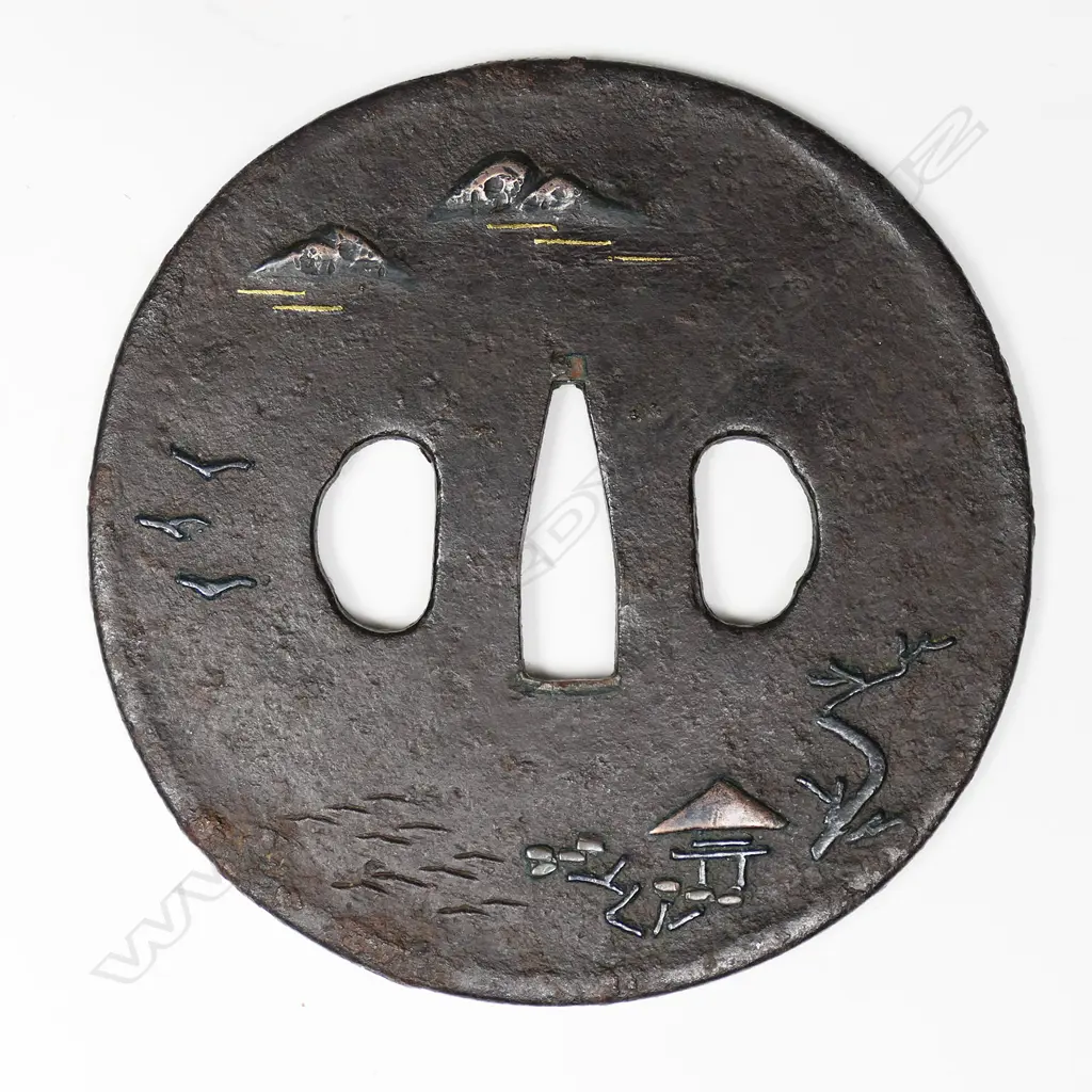 A large circular chocolate toned iron plate tsuba, Image 1++