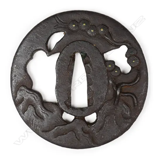 A circular iron 17thC tsuba,