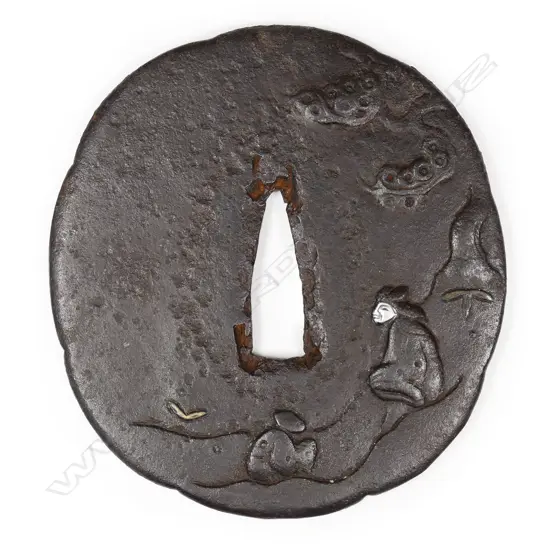 A large early Edo period chocolate toned iron tsuba, c.1650,
