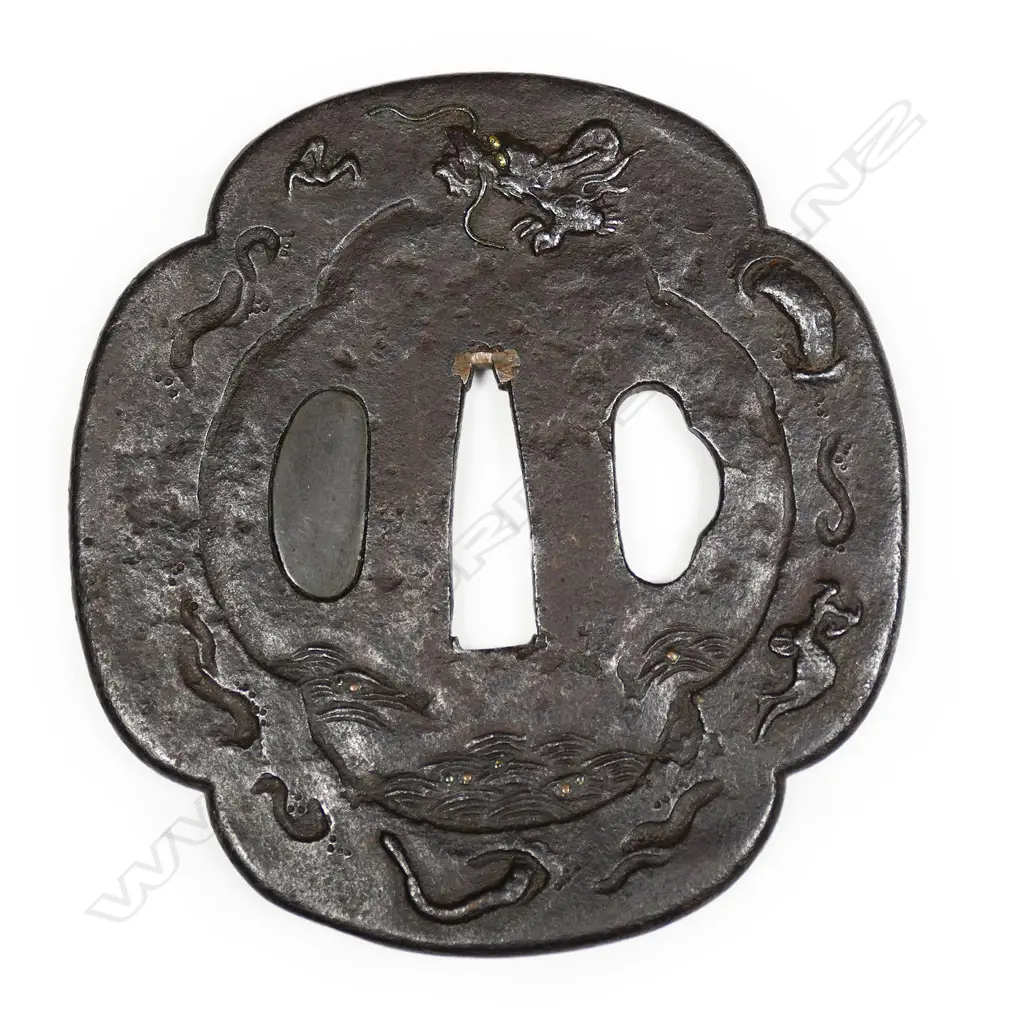 A large chocolate toned iron 17thC Mito school Edo Period tsuba, Image 1++