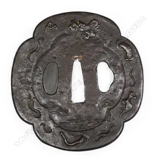 A large chocolate toned iron 17thC Mito school Edo Period tsuba,