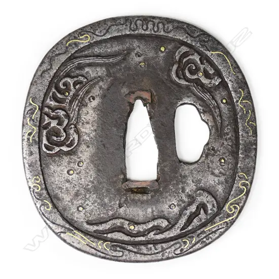 An iron Muromachi period oval tsuba with waves and zogan decoration c.1590,