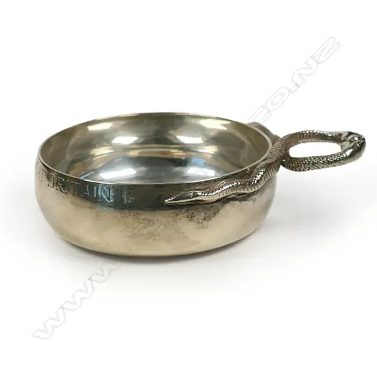 A silver sommelier’s tastevin with snake entwined handle,