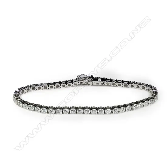 An 18ct white gold and diamond set tennis bracelet,