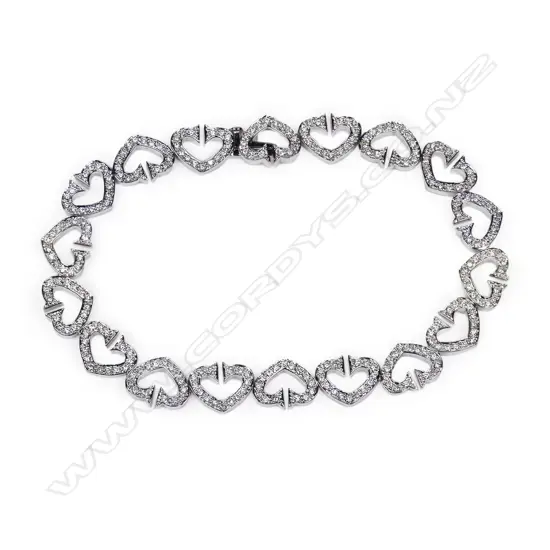 An 18ct white gold and diamond set heart link bracelet,