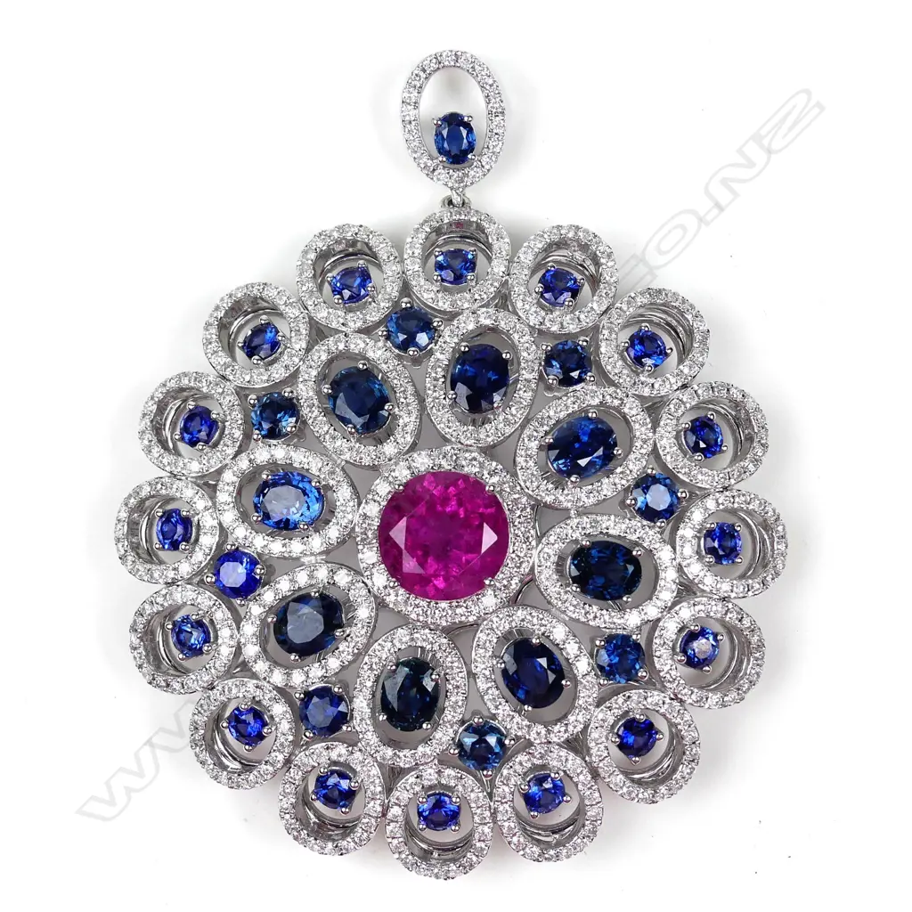 A large and impressive 18ct. white gold sapphire and diamond disc form pendant, Image 1++