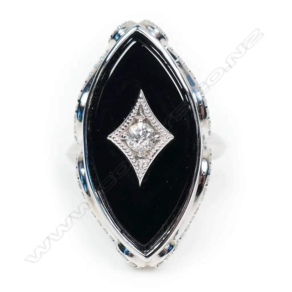A 14ct white gold onyx and diamond ring, Image 1++