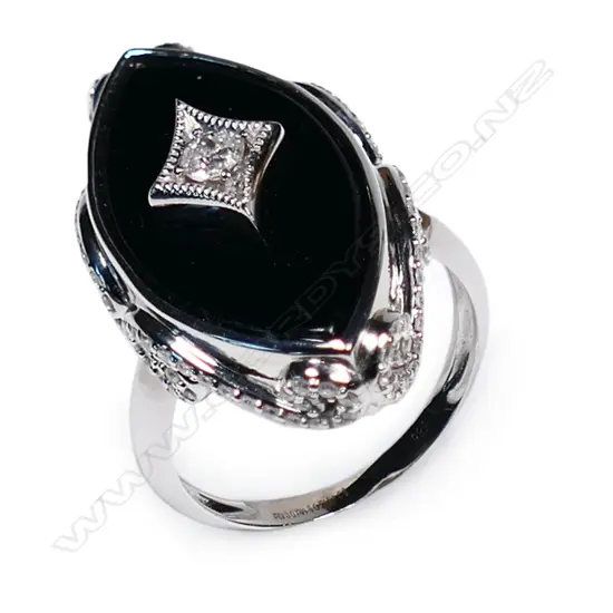 A 14ct white gold onyx and diamond ring,