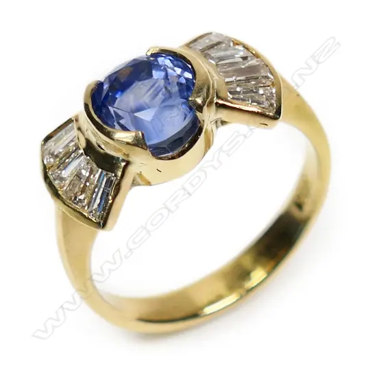 A 21ct gold sapphire and diamond ring,